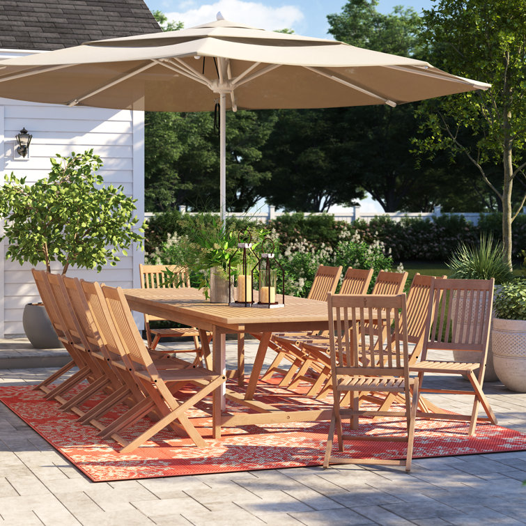 Extendable outdoor dining best sale table with umbrella hole